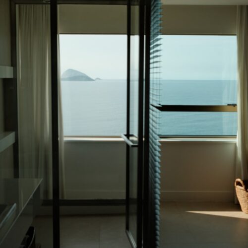 Sea view through the glass of a shower