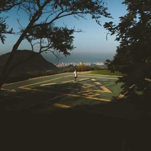 A person standing on the helicopter pad at Mirante Dona Marta