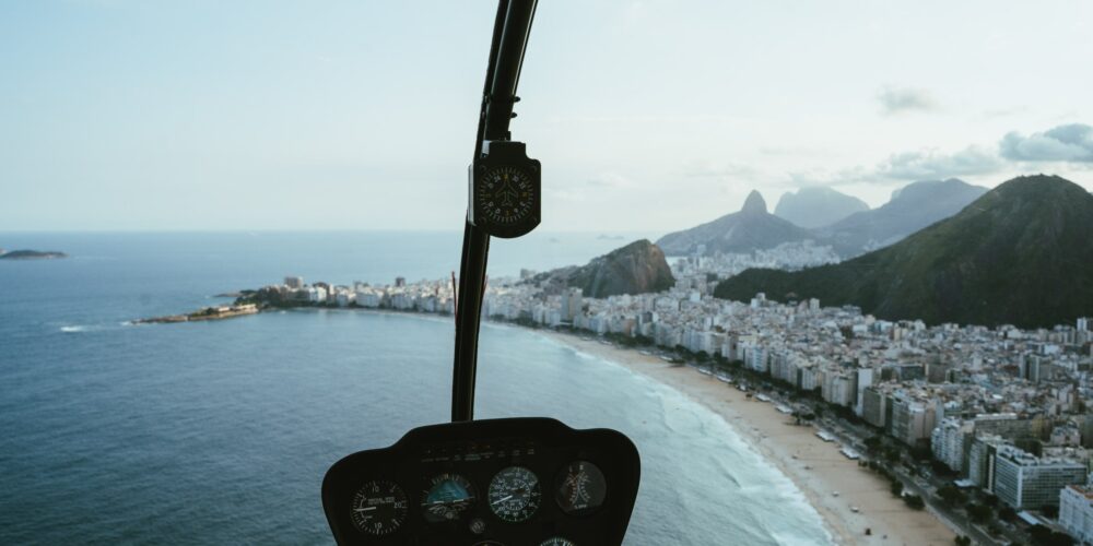 View from a helicopter window flying above Copacabana Beach
