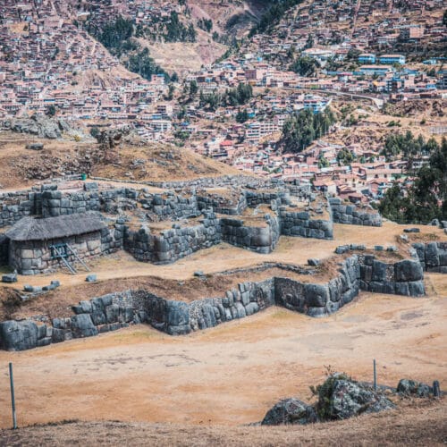 Sacsayhuaman with the city of Cusco on a hill behind